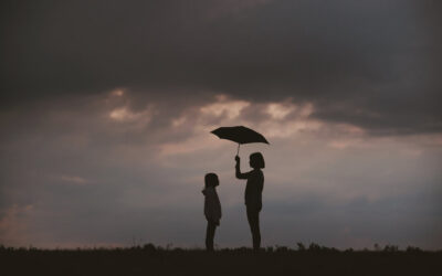 Kids under umbrella in storm - Flailing Forward article by Morris Weintraub